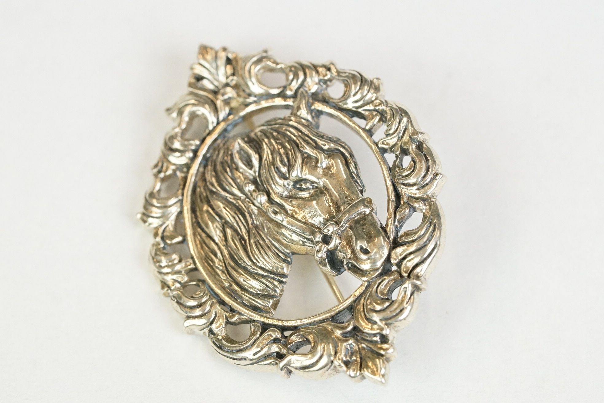 Silver horse brooch