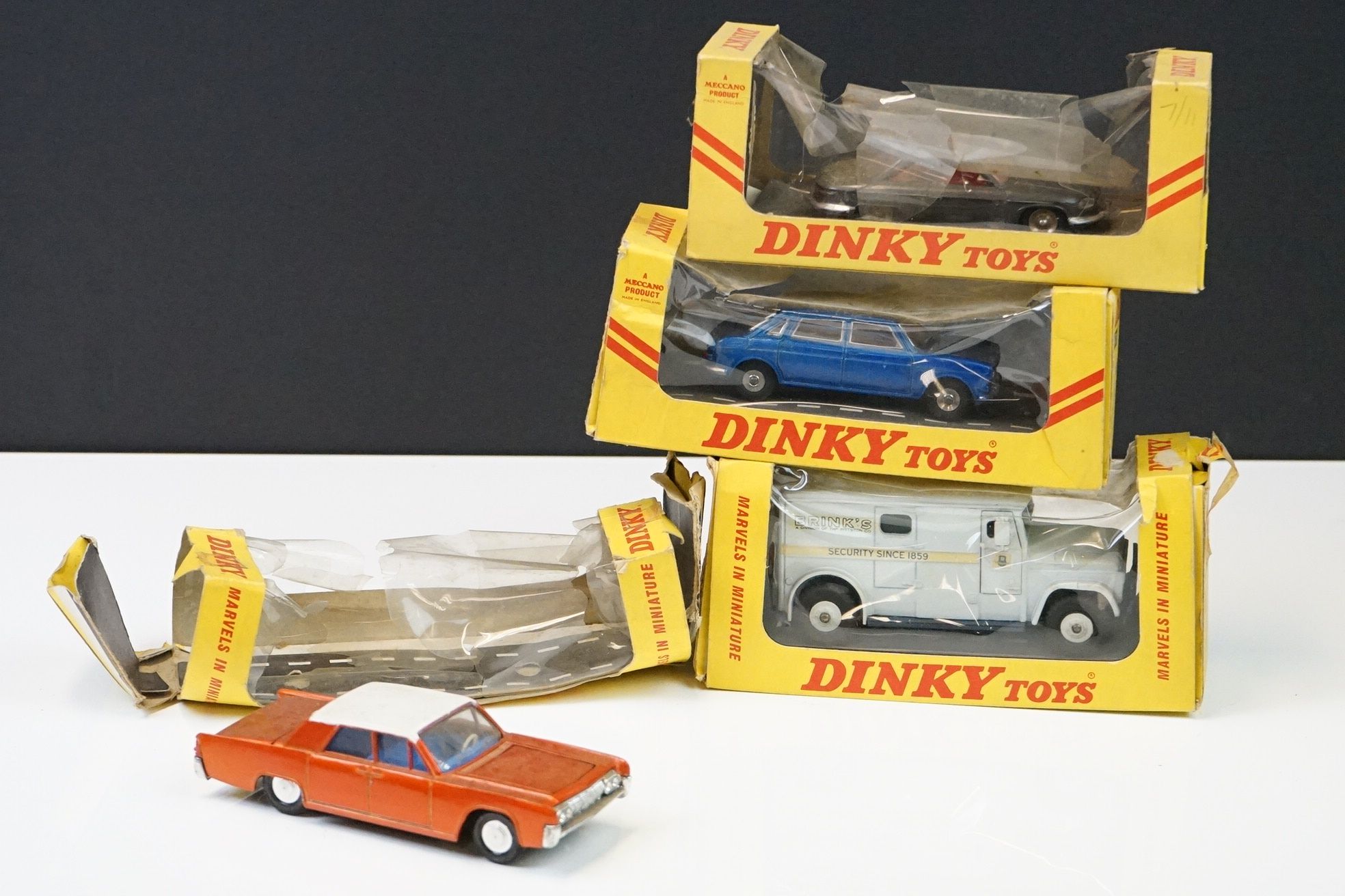 Four boxed Dinky diecast models to include 275 Brinks Armoured Car, 524 Panhard 24, 171 Austin