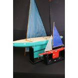 Large contemporary painted wooden pond yacht, 100cm long (sail currently detached), raised on an