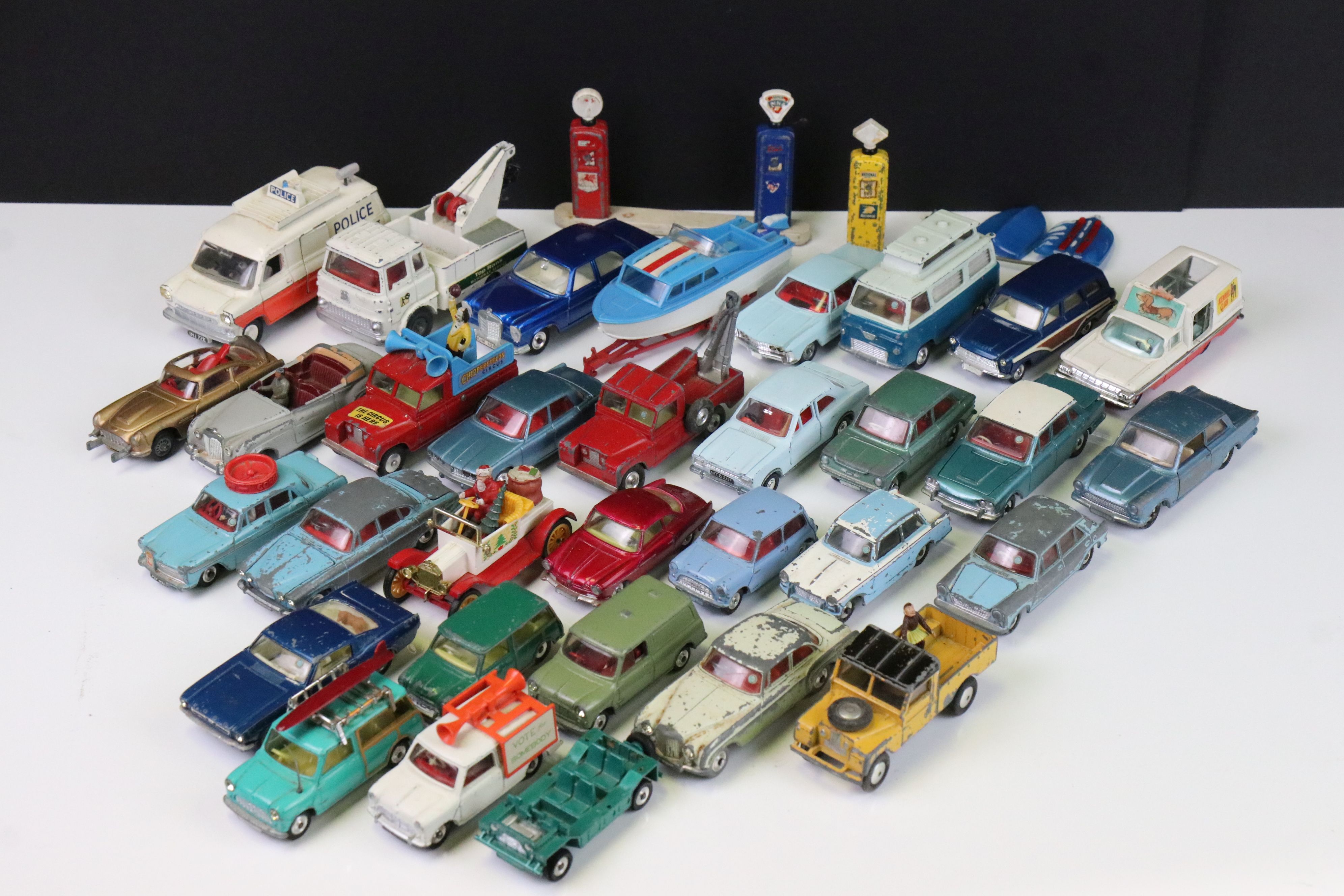 Around 32 Mid 20th C play worn diecast models to include Corgi & Dinky featuring Dinky Model T