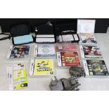 Three Nintendo DS Handheld consoles with cases plus 8 x ca5ed games to include Fifa 07, MarioKart DS