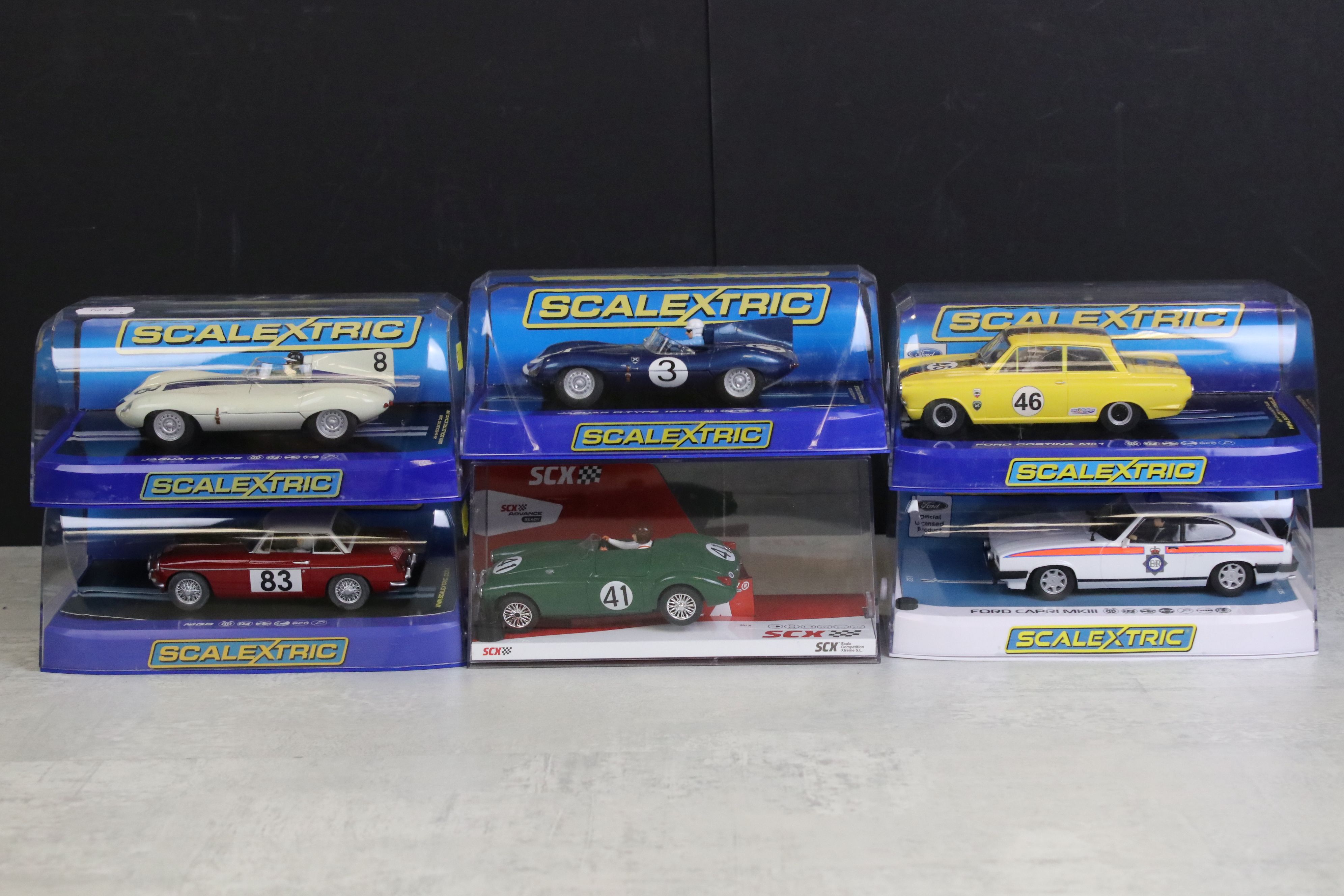 Six cased slot cars to include 5 x Scalextric (C3205 Jaguar D Type, C3502 Ford Cortina MK1, C3143