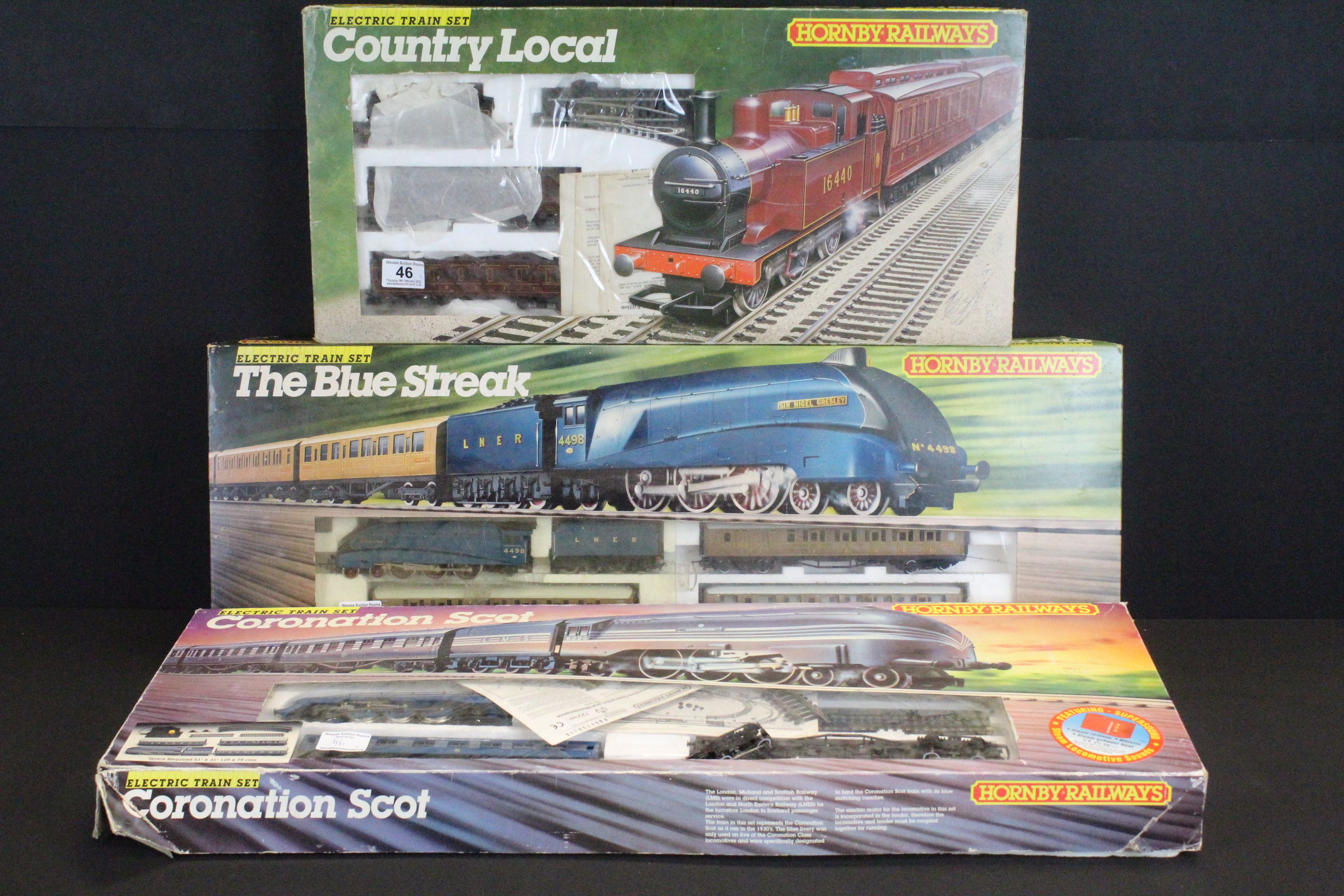 Three boxed Hornby OO gauge train sets to include R671 Country Local, R682 The Blue Streak and