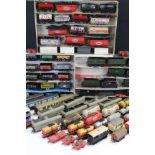 Over 80 OO gauge items of rolling stock to include tankers, tender, trucks and wagons featuring