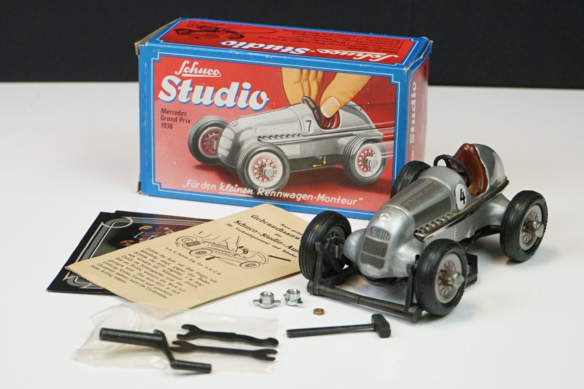 Boxed Schuco Studio Mercedes Grand Prix 1936 tinplate clockwork model, with key & accessories (model - Image 9 of 20