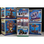Seven boxed Lemax buildings/accessories to include Round Up, Swing Boat, Trees & Wreaths Lot,