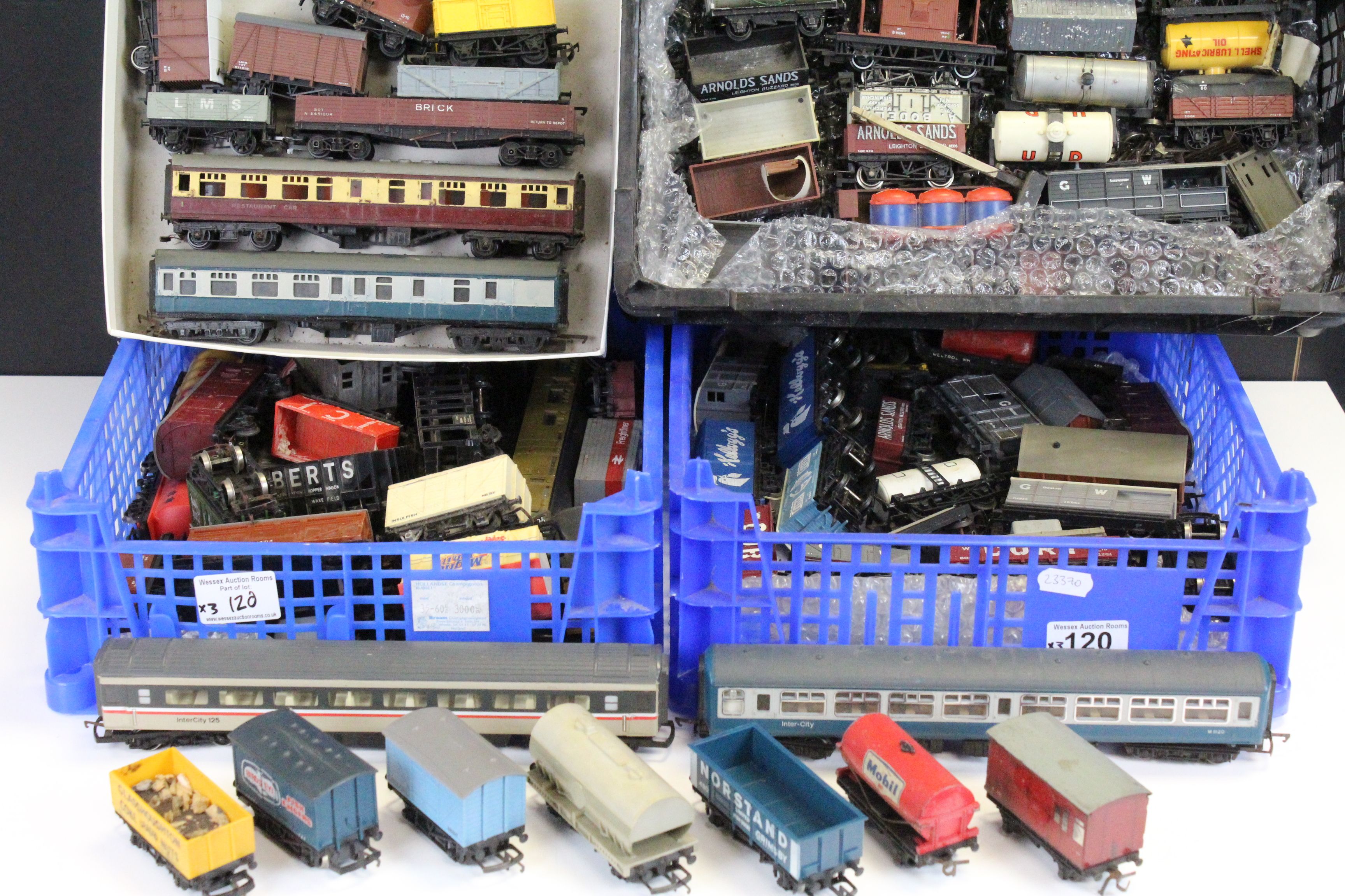 Over 90 OO gauge items of rolling stock to include wagons, trucks, tankers and coaches featuring