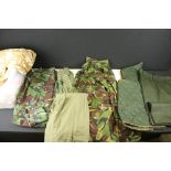 A Collection Of Mainly British / Nato Uniform To Include Trousers, Jackets And Shirts.