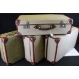 A collection of four British demobilisation suitcases.