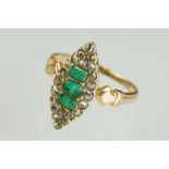 Late 19th century / early 20th century emerald and diamond marquise unmarked rose gold ring, an oval