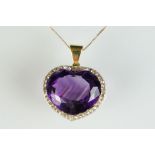 Amethyst and diamond 14ct yellow and white gold set pendant, the heart shaped mixed cut amethyst