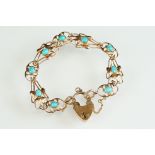 Art Nouveau turquoise 9ct rose gold bracelet, four sinuous openwork tapered panels and four openwork