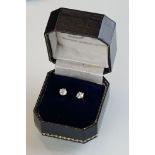 Pair of diamond 14ct white gold solitaire stud earrings, each diamond weighing approx 0.50 carat,