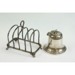 George V silver four-division toast rack raised on four paw feet, with loop handle (Sheffield