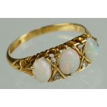 Opal and diamond yellow gold ring, three graduated oval cabochon cut precious white opals,