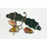 19th century hardstone unmarked silver brooch modelled as acorns, the oak leaves formed of carved