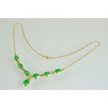Jade yellow gold necklace, the principal pear shaped cabochon cut jade measuring approx 12mm x