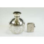 Early 20th Century silver & cut glass perfume bottle, with cast scrolling silver border and hinged