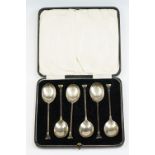 George V cased set of six silver coffee spoons of plain polished form with flat-ended finials,