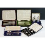 Four Cased silver cutlery sets comprising a George V three-piece christening set (Mappin & Webb,