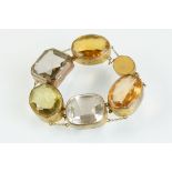 19th century rock crystal, smoky quartz and paste bracelet, three oval mixed cut paste panels, two