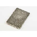 Late 19th / early 20th century white metal rectangular card case, highly decorated with chased