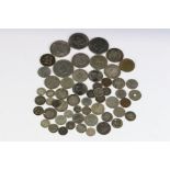A Collection of British and foreign coins to include pre decimal silver examples.