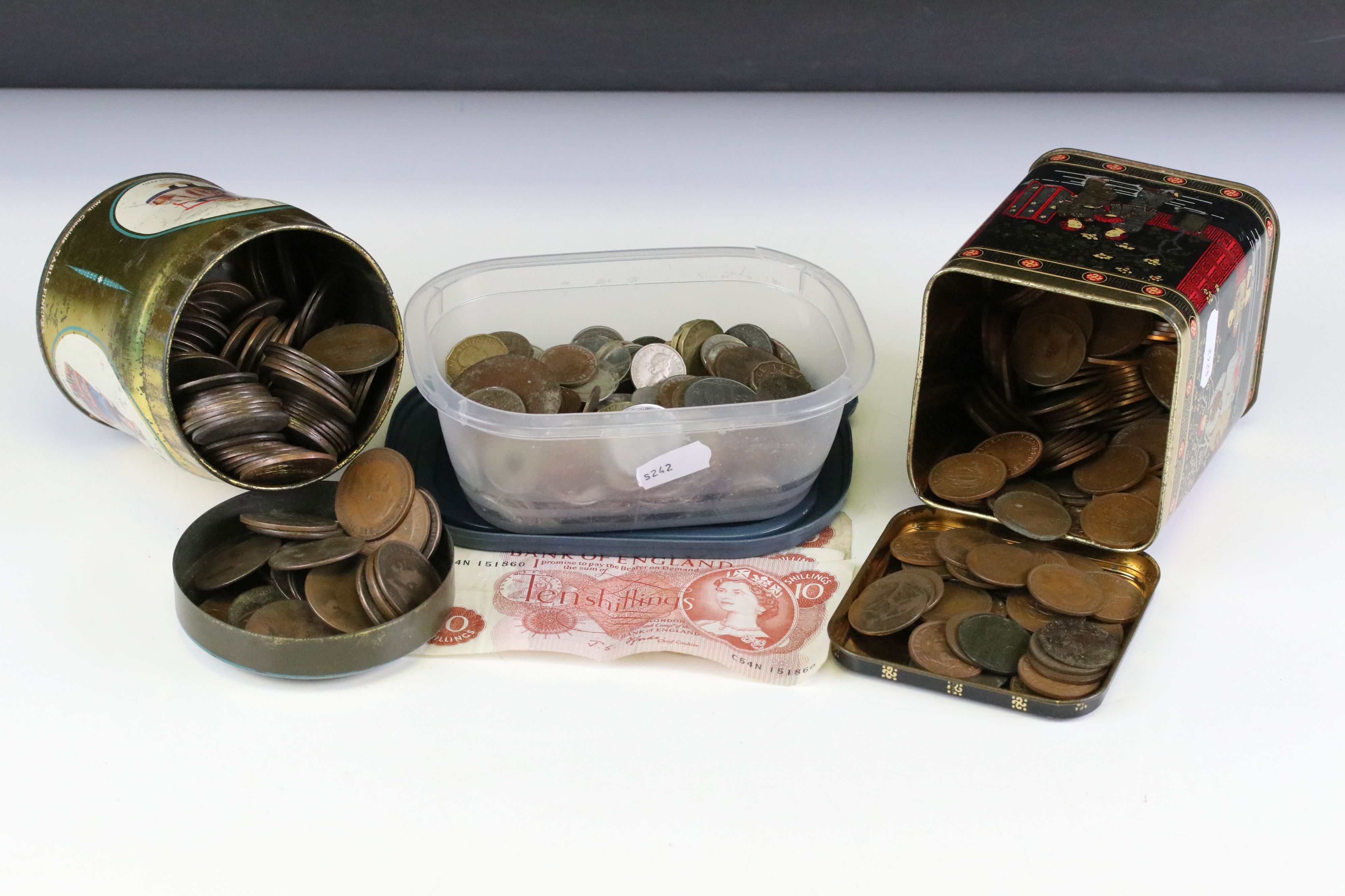 A collection of British and foreign coins and banknotes to include pre decimal silver examples.