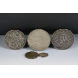A small group of British pre decimal coins to include a King George V 1935 Crown, a Queen Victoria