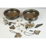 A small collection of silver and silver plated items to include bottle coasters, wine taster,