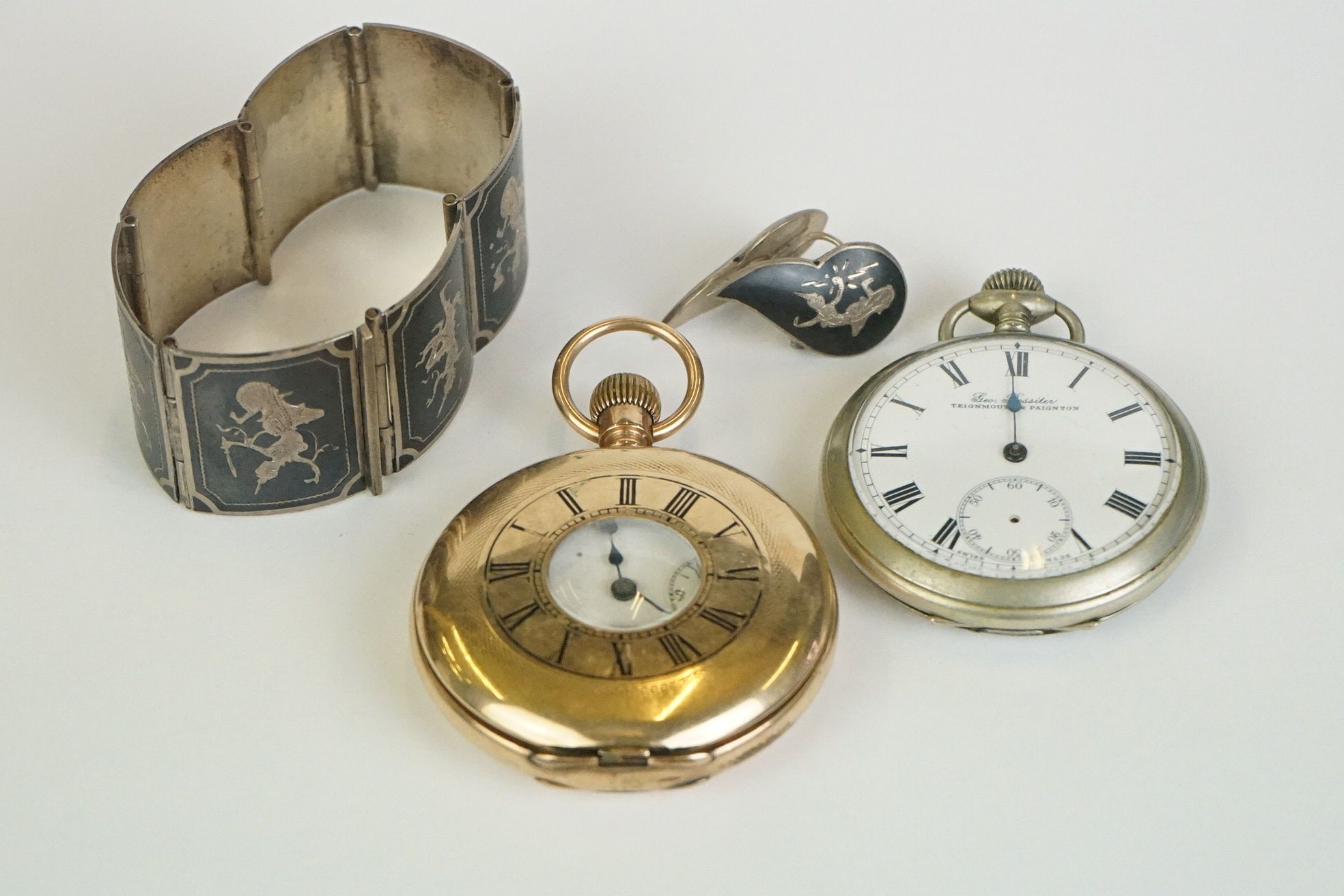 Two early 20th century top winding pocket watches to include a gold plated half hunter together with