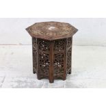 Indian Hardwood Octagonal Folding Table, profusely carved with berries and foliage, 39cm wide x 42cm