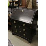 George III Bureau, the drop front opening to a fitted interior, over two short and two long drawers,