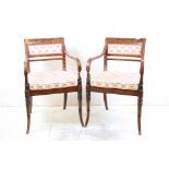 Pair of Regency veneered Elbow Chairs, the top rail painted with swags, cane seats and upholstered