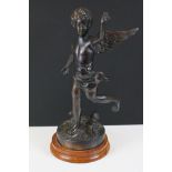 Cast Metal Figure of a Cherub mounted on a wooden base