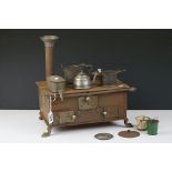 Early 20th Century childs tin plate toy cooking stove with cooking pots & pans, chimney and hinged