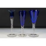 Two Contemporary cobalt blue wine glasses with spiral air twists to clear glass stems (tallest