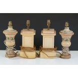 A pair of decorative turned wooden lamps with floral decoration together with a pair of column