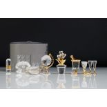 Group of Swarovski Crystal miniature ornaments to include a globe, ice bucket, oyster shell, wine