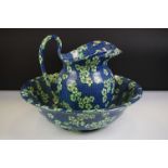 Early 20th century Royal Cauldron Wash Bowl and Jug decorated with green flowers on a blue patterned