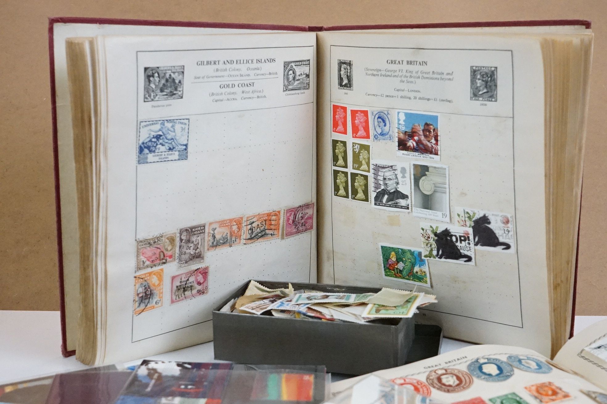 A small collection of British and world stamps contained within three albums together with a small - Image 2 of 7