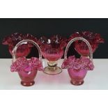 Set of three Cranberry glass footed dishes of lobed form (1 a/f), raised on knopped circular