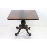 19th century Rosewood Fold over Tea Table raised on a bulbous carved pedestal support with four