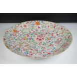 Chinese Porcelain Famille Rose Charger decorated in the hundred flower design, Qianlong mark to