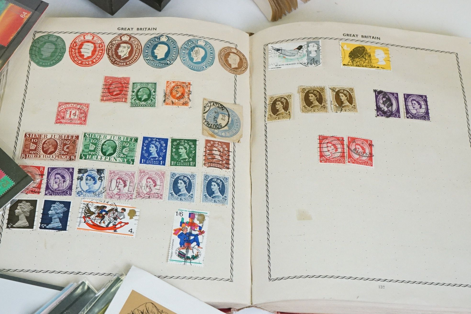 A small collection of British and world stamps contained within three albums together with a small - Image 4 of 7