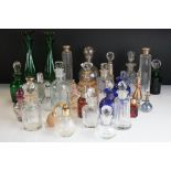 A collection of mainly vintage scent / perfume bottles to include a fully hallmarked sterling silver