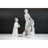 Nao porcelain figure of a girl filling urn at the water well, 29cm high, together with a Lladro