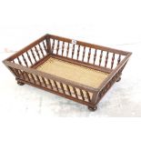 Early 20th century Walnut Doll's Cot or Dog Bed with bergere cane base, 70cm long x 20cm high