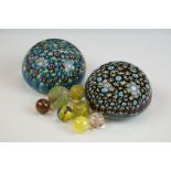 Two Murano millefiori glass paperweights of domed form, 7cm diameter, together with a small group of