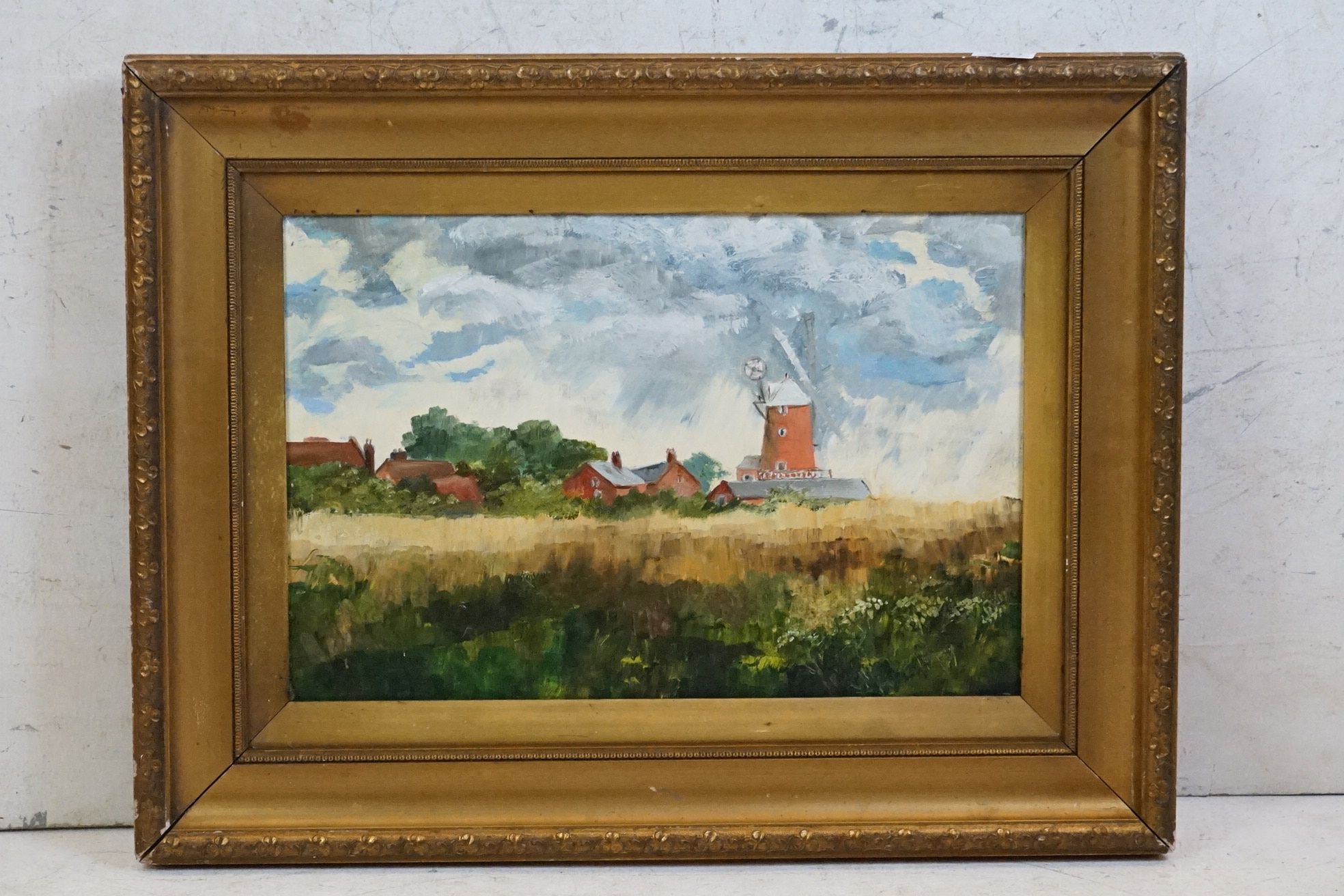 Gilt framed oils on board, a view of farmhouse and windmill through cornfields in Summer, signed